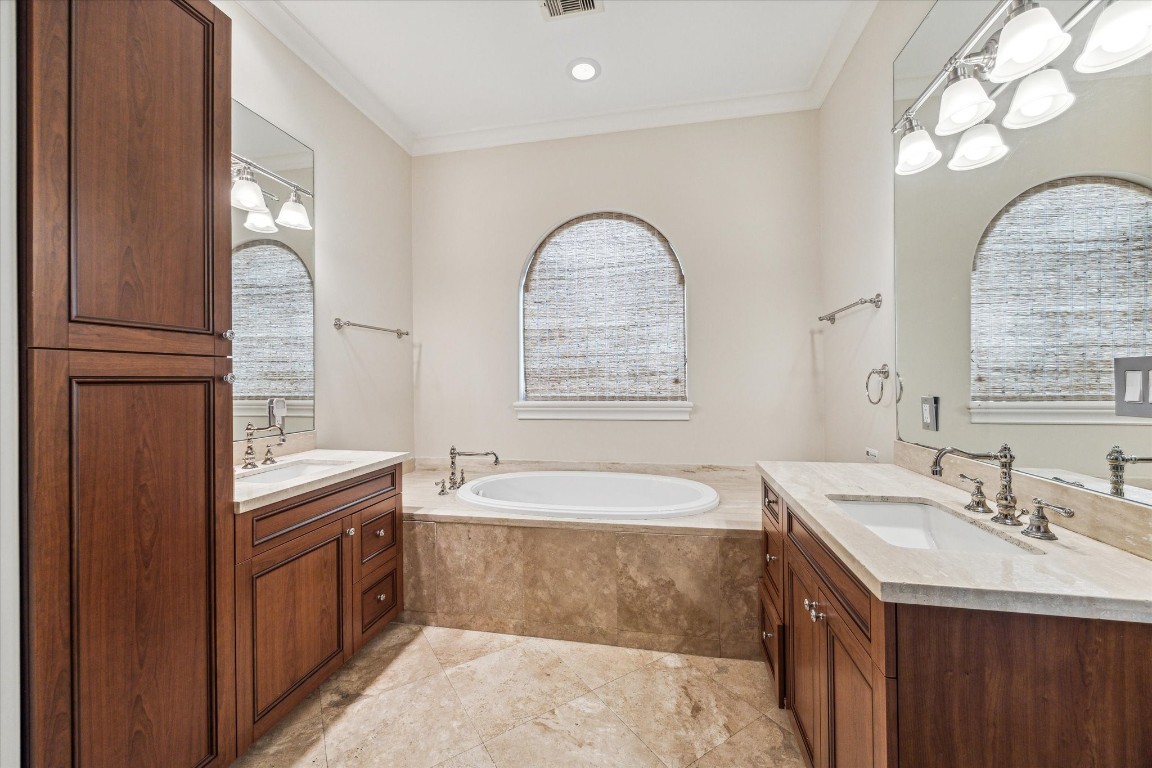 5213 Feagan Street, Unit A Houston, TX 77007 - Photo 26 of 47 a bathroom with a tub double vanity sink and mirror