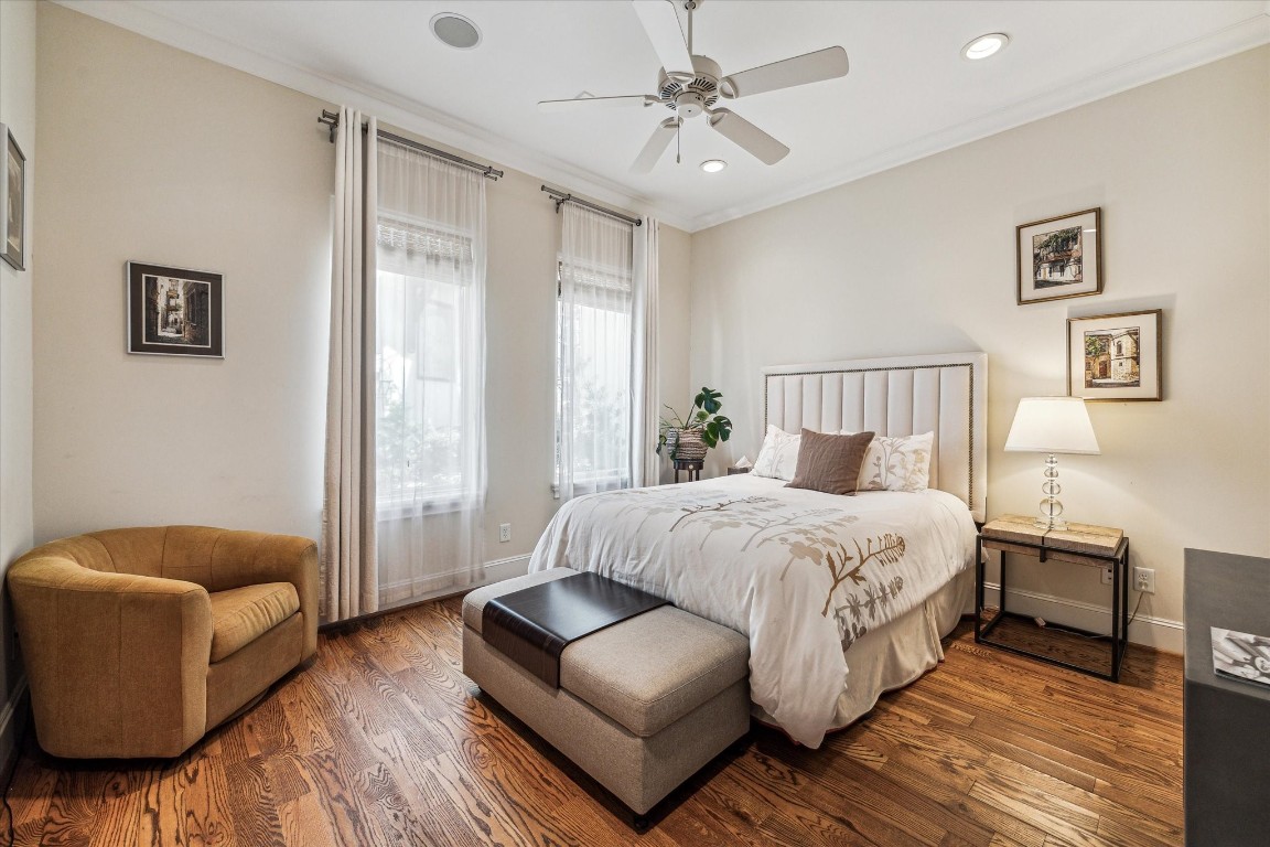 5213 Feagan Street, Unit A Houston, TX 77007 - Photo 28 of 47 a bedroom with a bed couch and a window