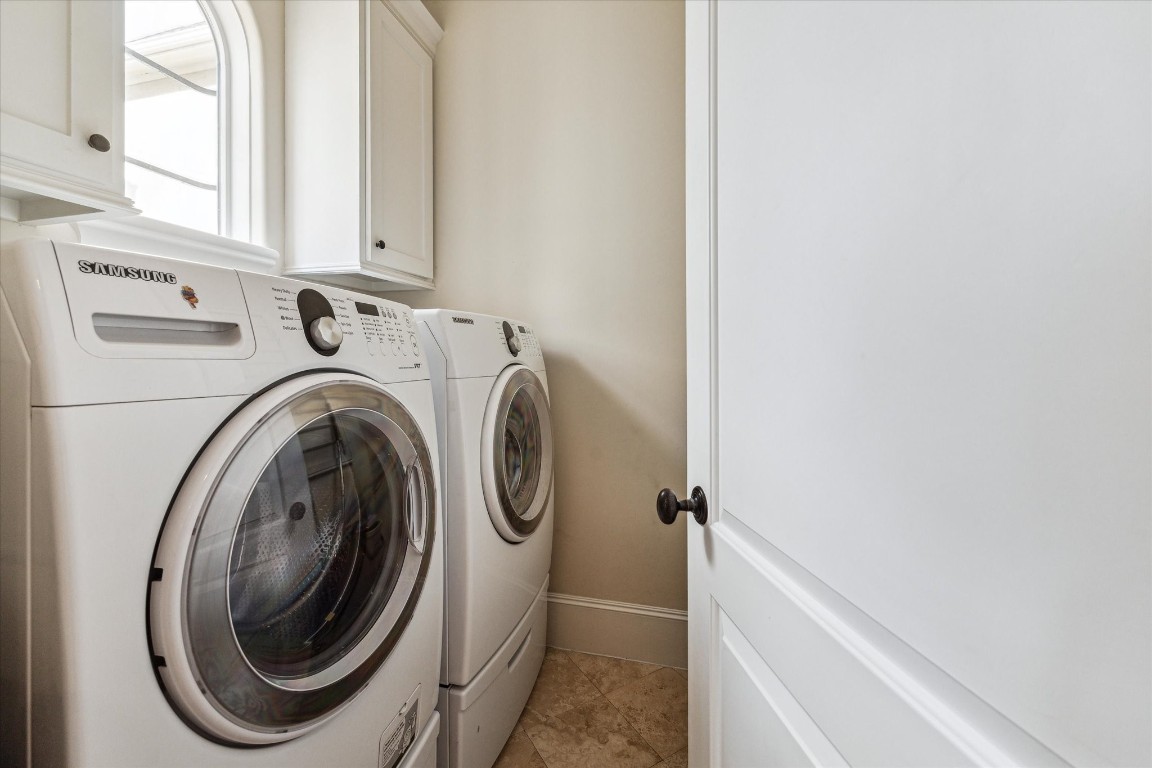 5213 Feagan Street, Unit A Houston, TX 77007 - Photo 32 of 47 a utility room with dryer and washer