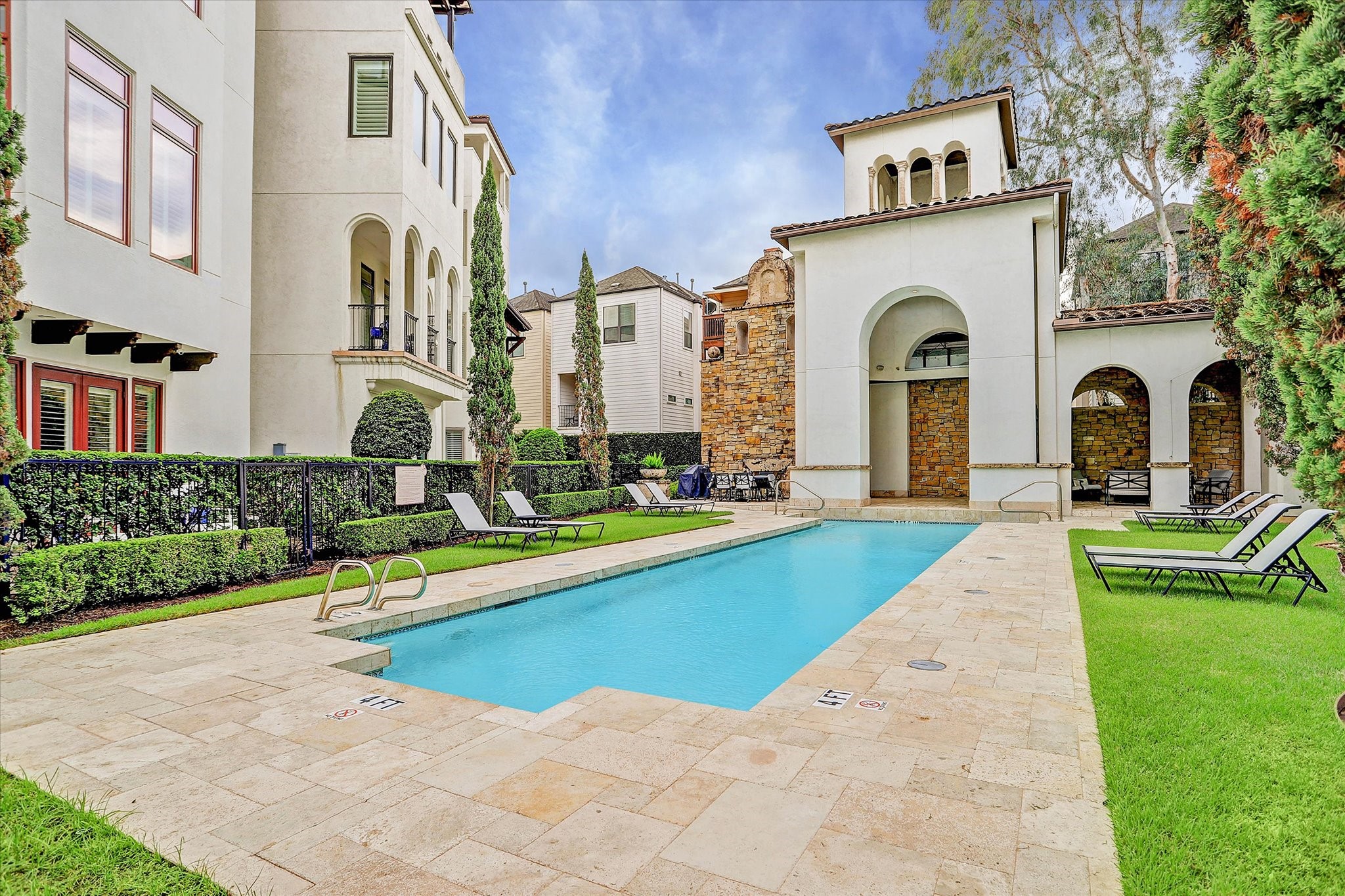 5213 Feagan Street, Unit A Houston, TX 77007 - Photo 37 of 47 Whether you’re swimming laps, lounging by the water, or enjoying the shade of the well-appointed clubhouse, the community pool area is a true retreat.