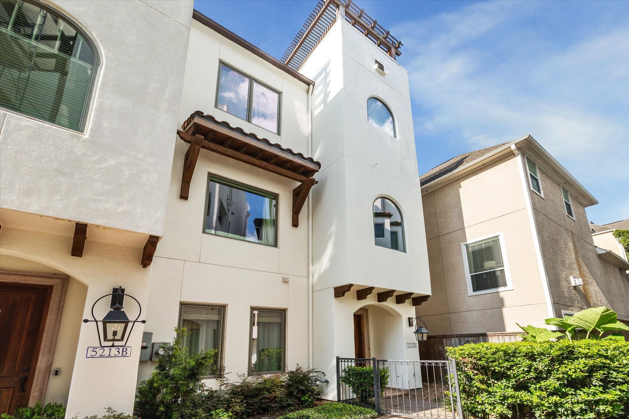 5213 Feagan Street, Unit A Houston, TX 77007 - Photo 5 of 47 Welcome to your dream Spanish-style villa in the exclusive gated community of Caceres, nestled in the heart of Rice Military.