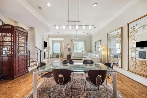 a living room with fireplace furniture and a wooden floor