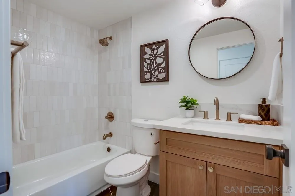 12701 McFeron Road Poway, CA 92064 - Photo 16 of 32 a bathroom with a sink a toilet and a mirror