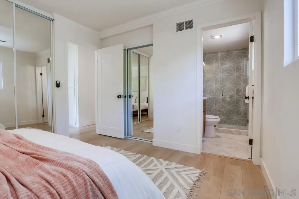 12701 McFeron Road Poway, CA 92064 - Photo 19 of 32 a bedroom with a bed and a bathroom