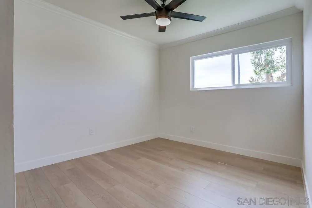 12701 McFeron Road Poway, CA 92064 - Photo 23 of 32 an empty room with a window and a fan