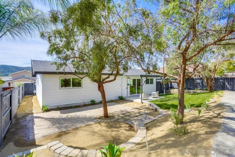 12701 McFeron Road Poway, CA 92064 - Photo 30 of 32 a tree in front of a white house