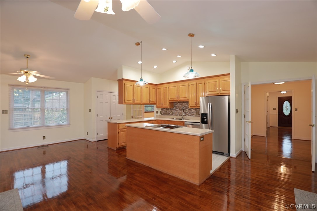 2106 Mt Blanco Road Chester, VA 23836 - Photo 11 of 50 a kitchen with stainless steel appliances granite countertop a refrigerator a sink dishwasher a stove and white countertops with wooden floor