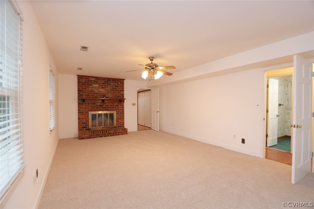 2106 Mt Blanco Road Chester, VA 23836 - Photo 21 of 50 a view of a livingroom with a ceiling fan and window