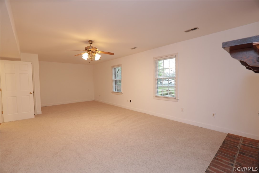 2106 Mt Blanco Road Chester, VA 23836 - Photo 26 of 50 an empty room with windows and fan