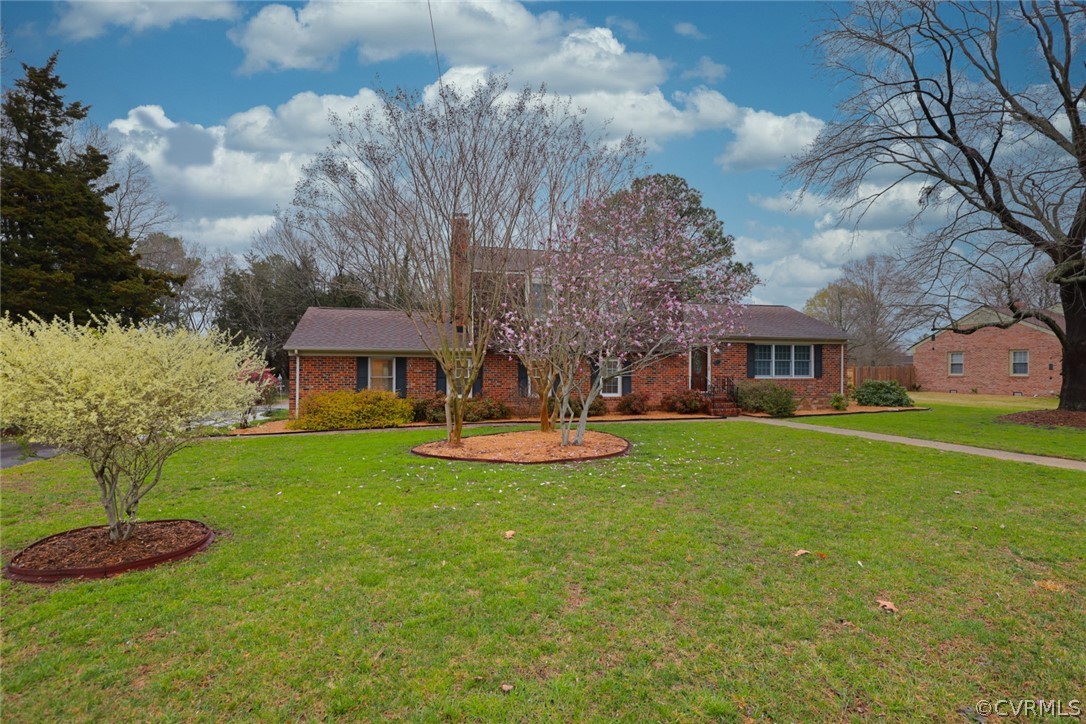 2106 Mt Blanco Road Chester, VA 23836 - Photo 3 of 50 a front view of a house with garden