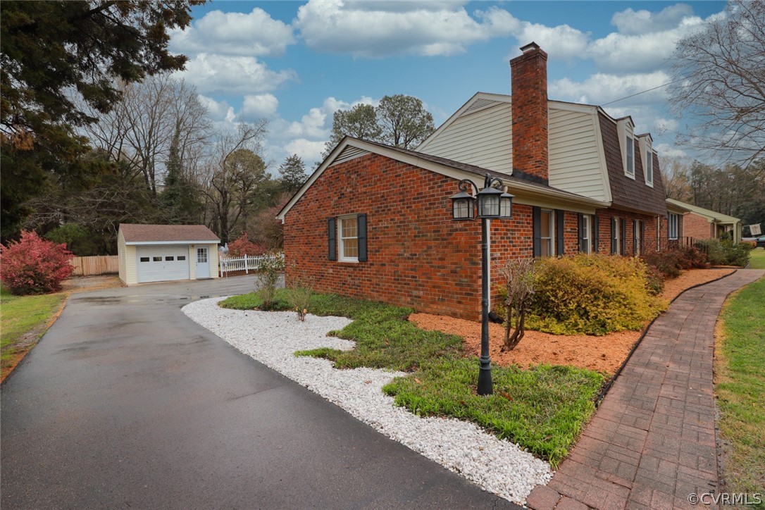 2106 Mt Blanco Road Chester, VA 23836 - Photo 33 of 50 a front view of a house with garden