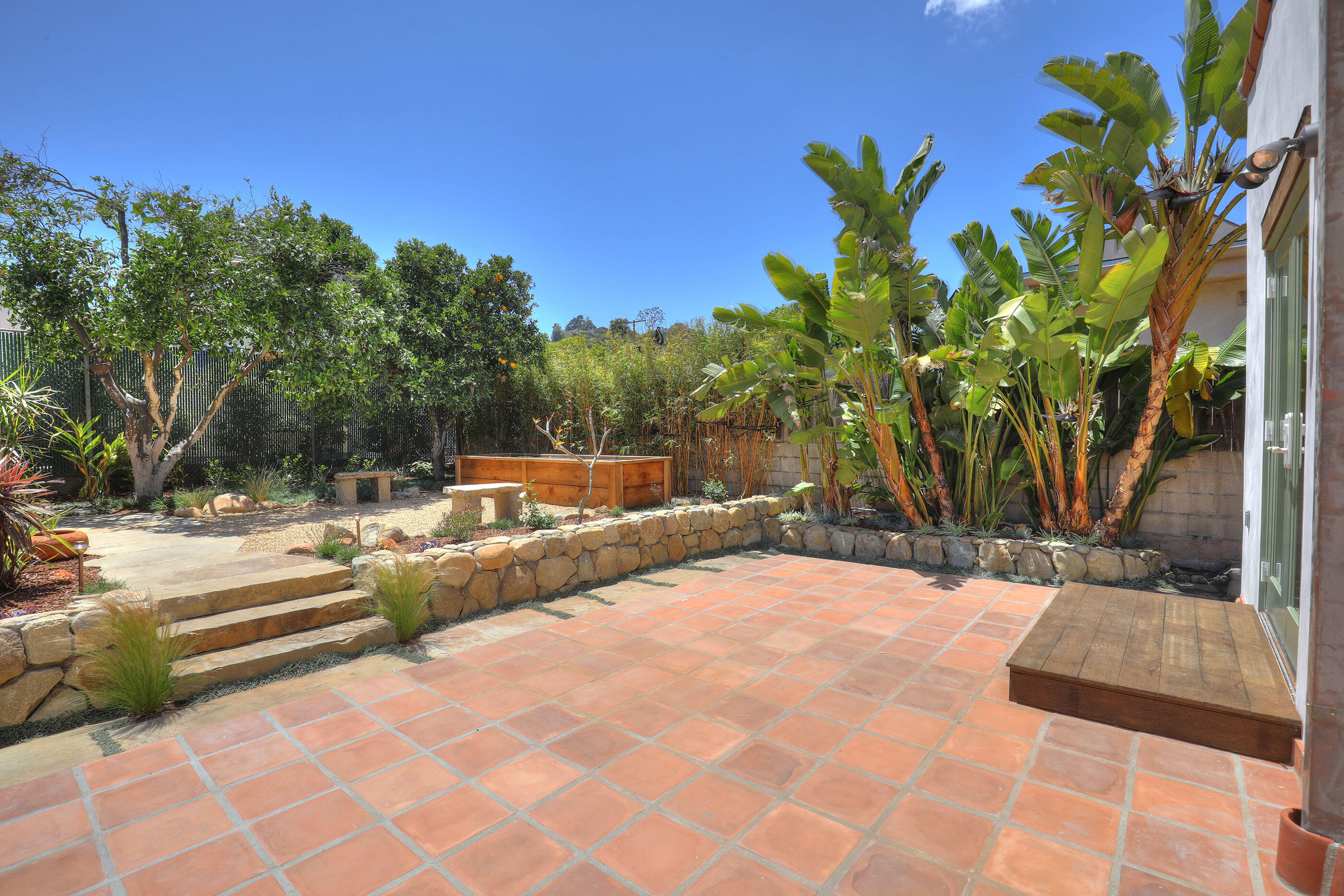 1621 Clearview Road Santa Barbara, CA 93101 - Photo 14 of 20 a view of backyard with a table and chairs and potted plants