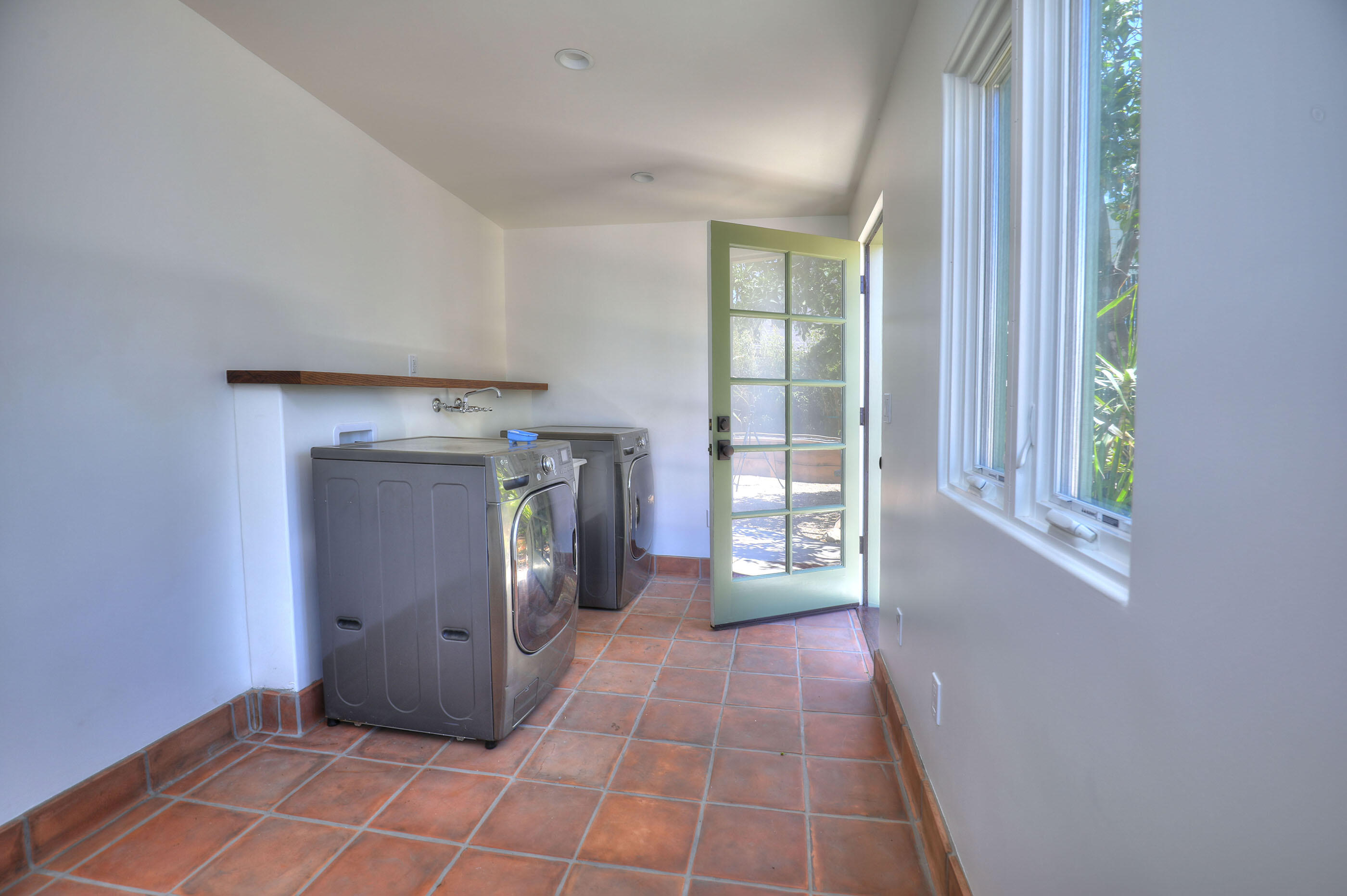 1621 Clearview Road Santa Barbara, CA 93101 - Photo 16 of 20 a view of an empty room with a fireplace and a window