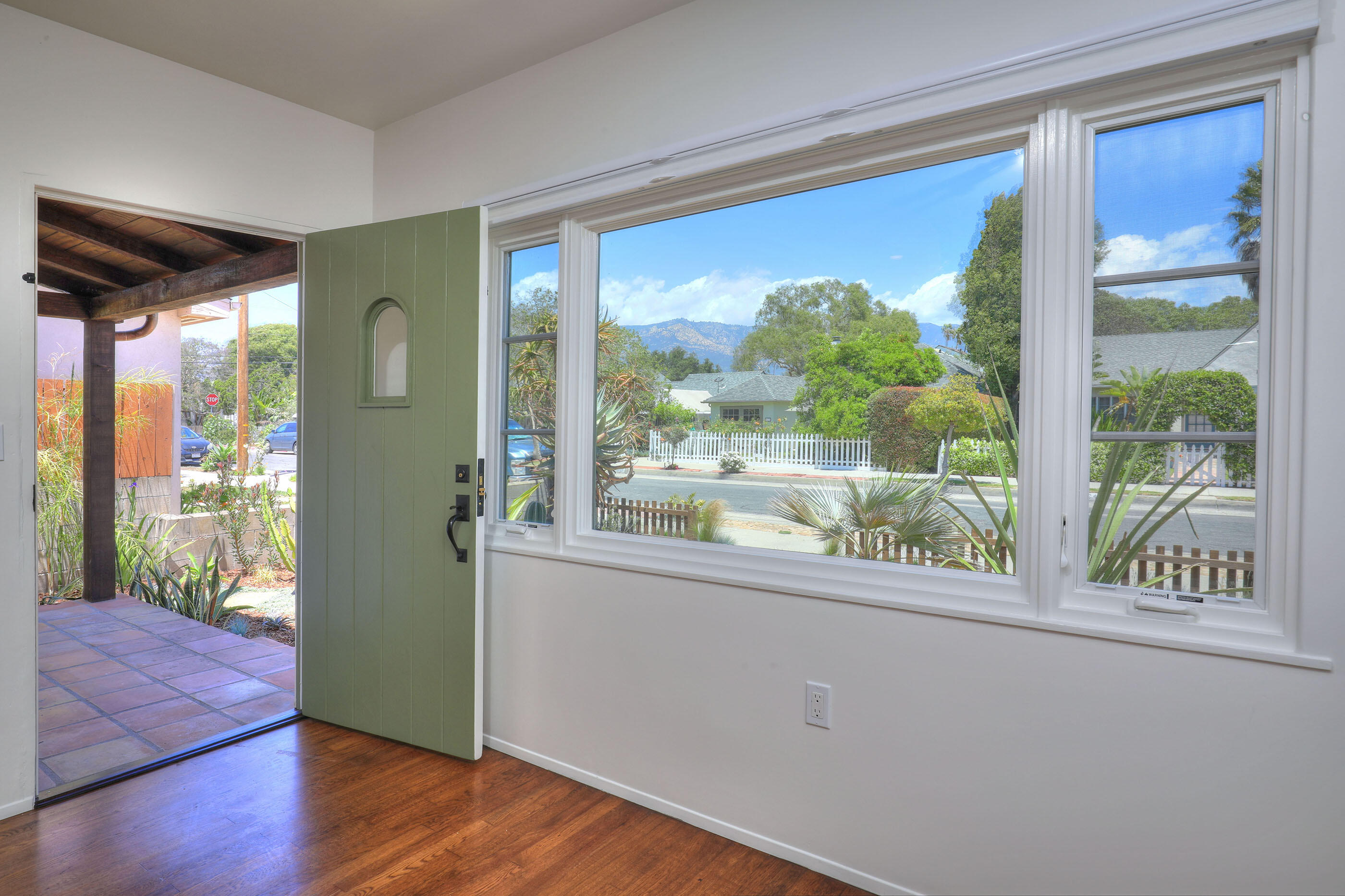 1621 Clearview Road Santa Barbara, CA 93101 - Photo 3 of 20 a view of a room that has a large window with wooden floor