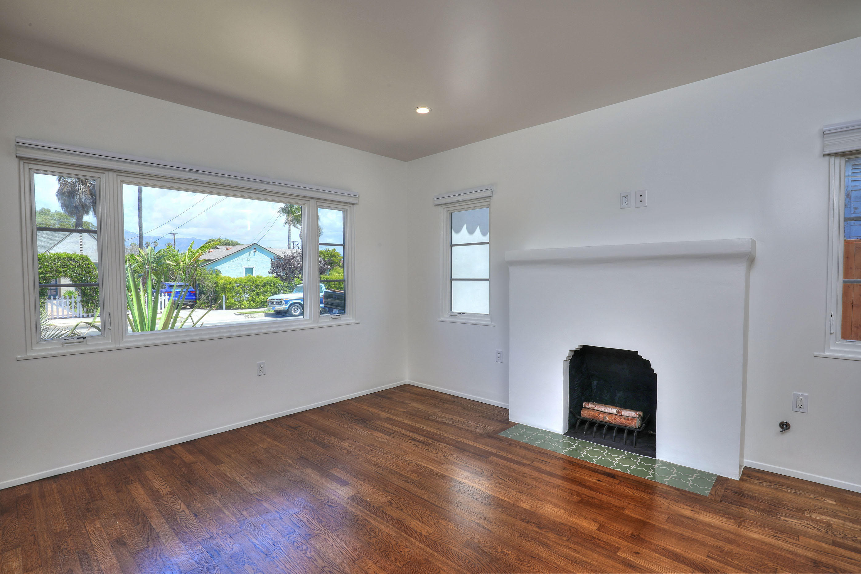 1621 Clearview Road Santa Barbara, CA 93101 - Photo 5 of 20 an empty room with wooden floor and a window