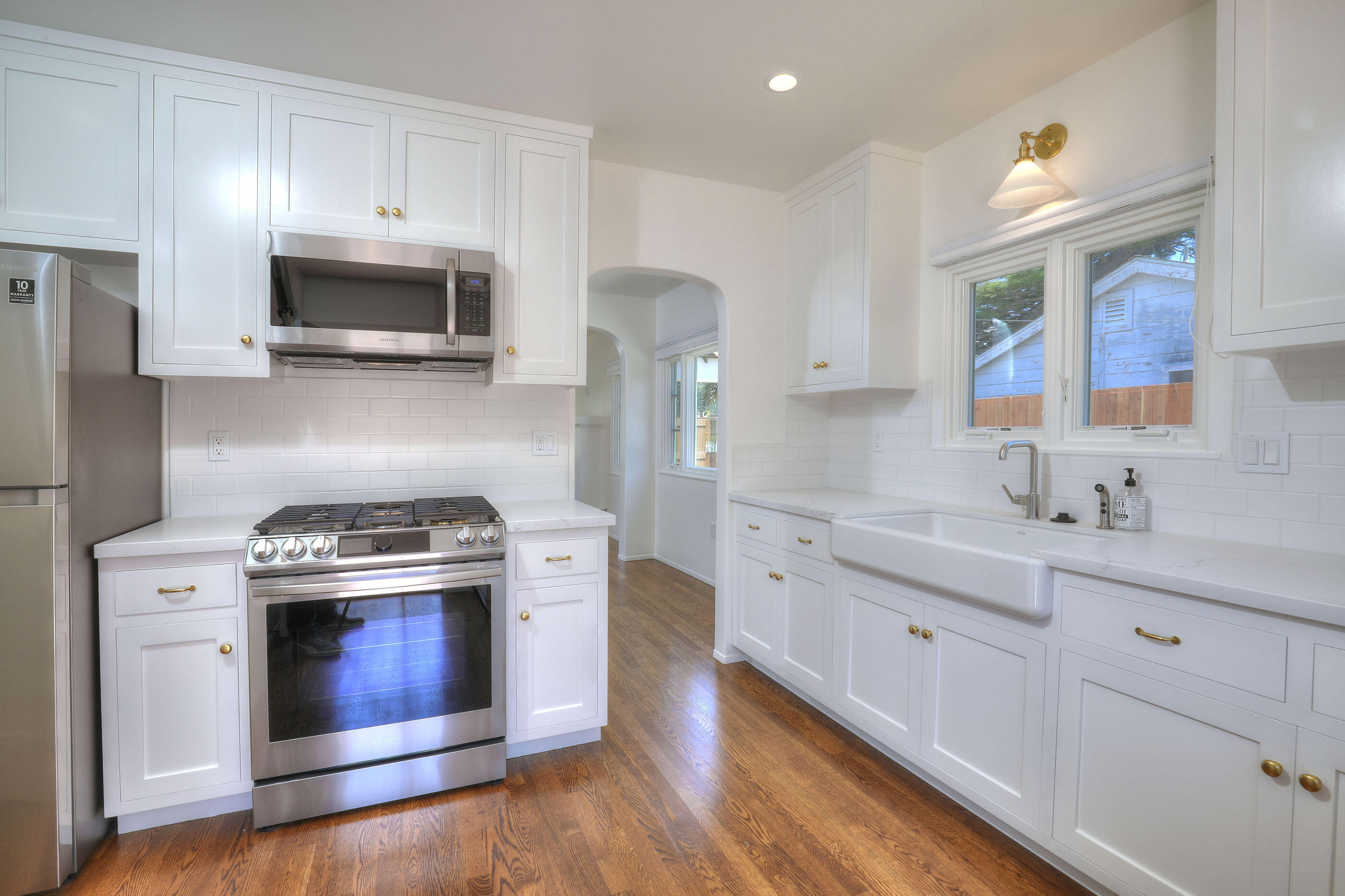 1621 Clearview Road Santa Barbara, CA 93101 - Photo 8 of 20 a kitchen with stainless steel appliances white cabinets a sink and a stove