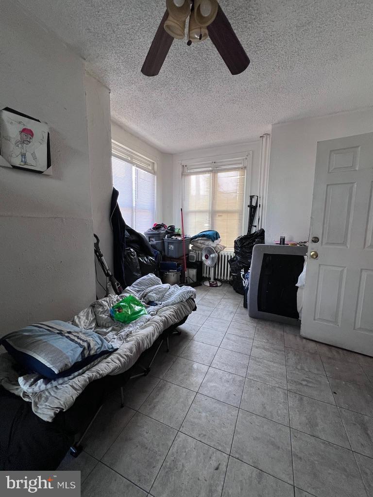 1601 St. Paul Street Philadelphia, PA 19140 - Photo 15 of 17 a living room with furniture and a window