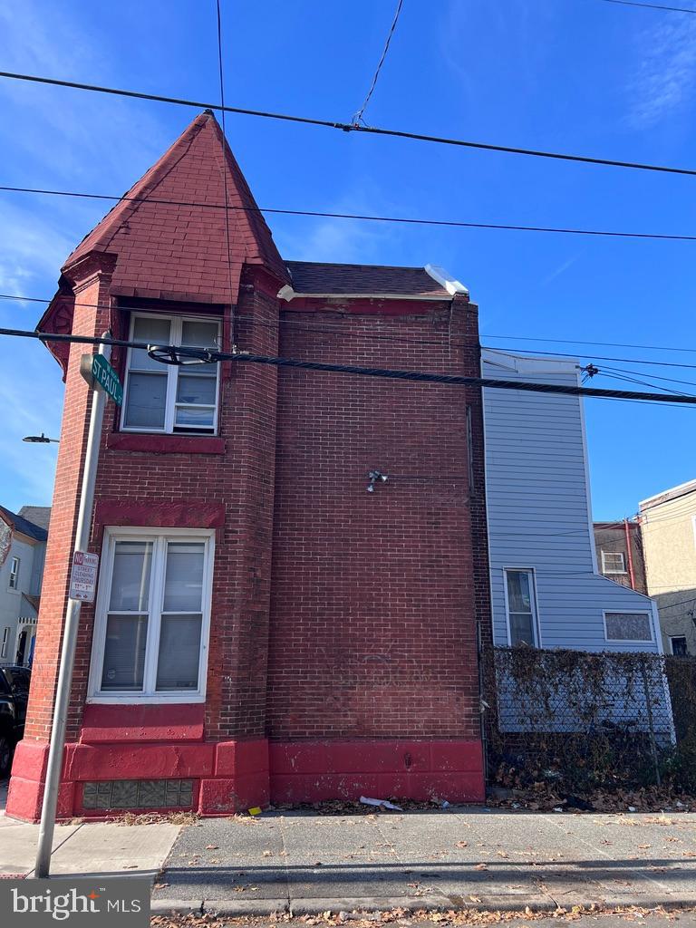 1601 St. Paul Street Philadelphia, PA 19140 - Photo 3 of 17 a view of a brick house with large windows