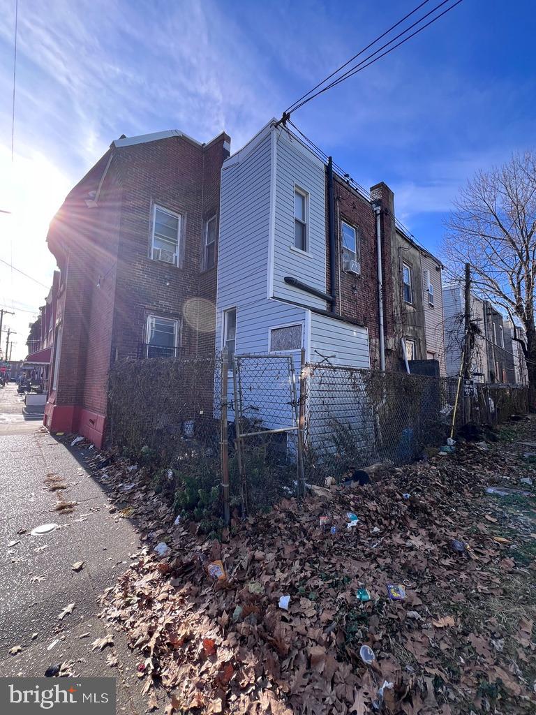 1601 St. Paul Street Philadelphia, PA 19140 - Photo 5 of 17 a view of a brick house next to a yard