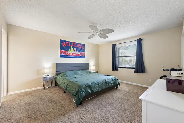 a bedroom with a bed and a table in it