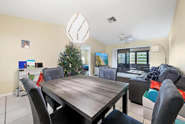 a outdoor dining space with furniture and wooden floor