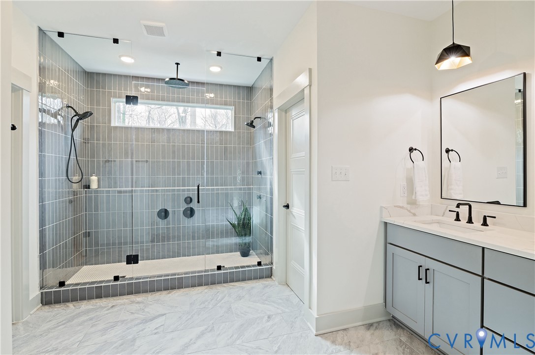 8919 Rustic Road Richmond, VA 23235 - Photo 23 of 36 Spacious walk-in shower featuring glass enclosure,