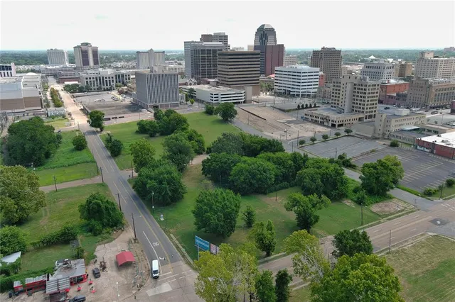 an aerial view of city and lake