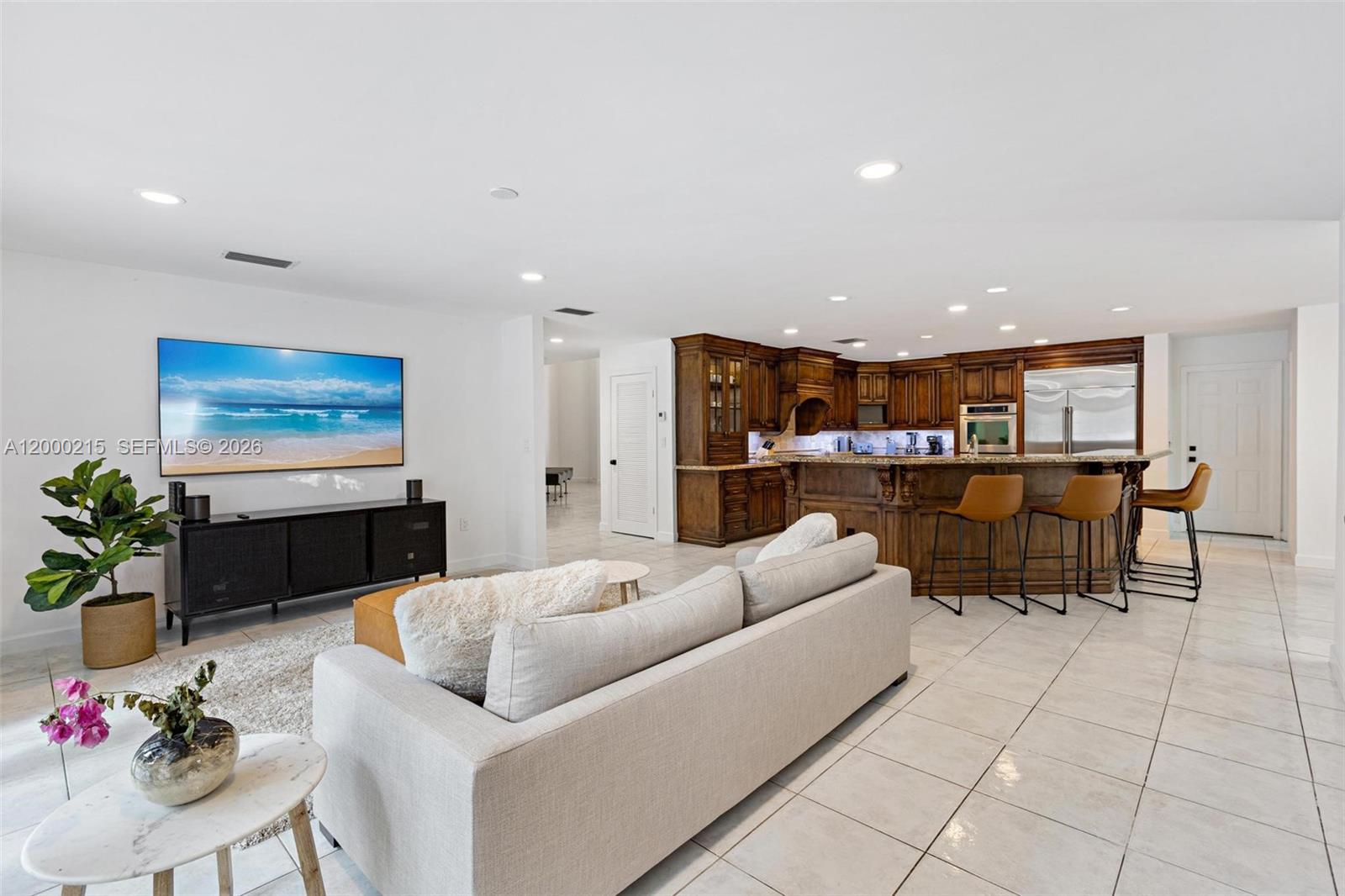 14850 Old Cutler Road Palmetto Bay, FL 33158 - Photo 11 of 19 a living room with furniture kitchen and a table