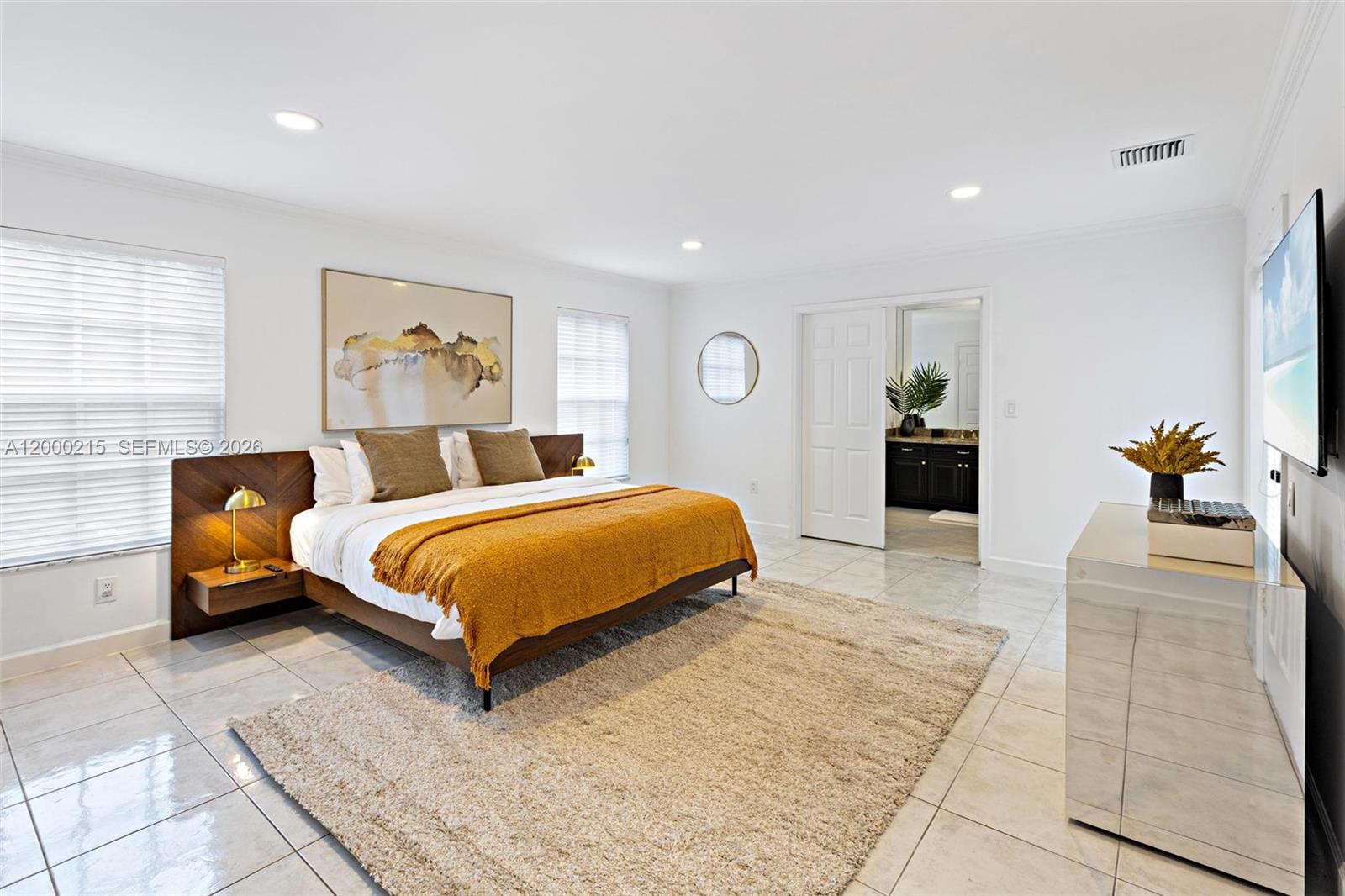 14850 Old Cutler Road Palmetto Bay, FL 33158 - Photo 14 of 19 a bedroom with a large bed and a couch