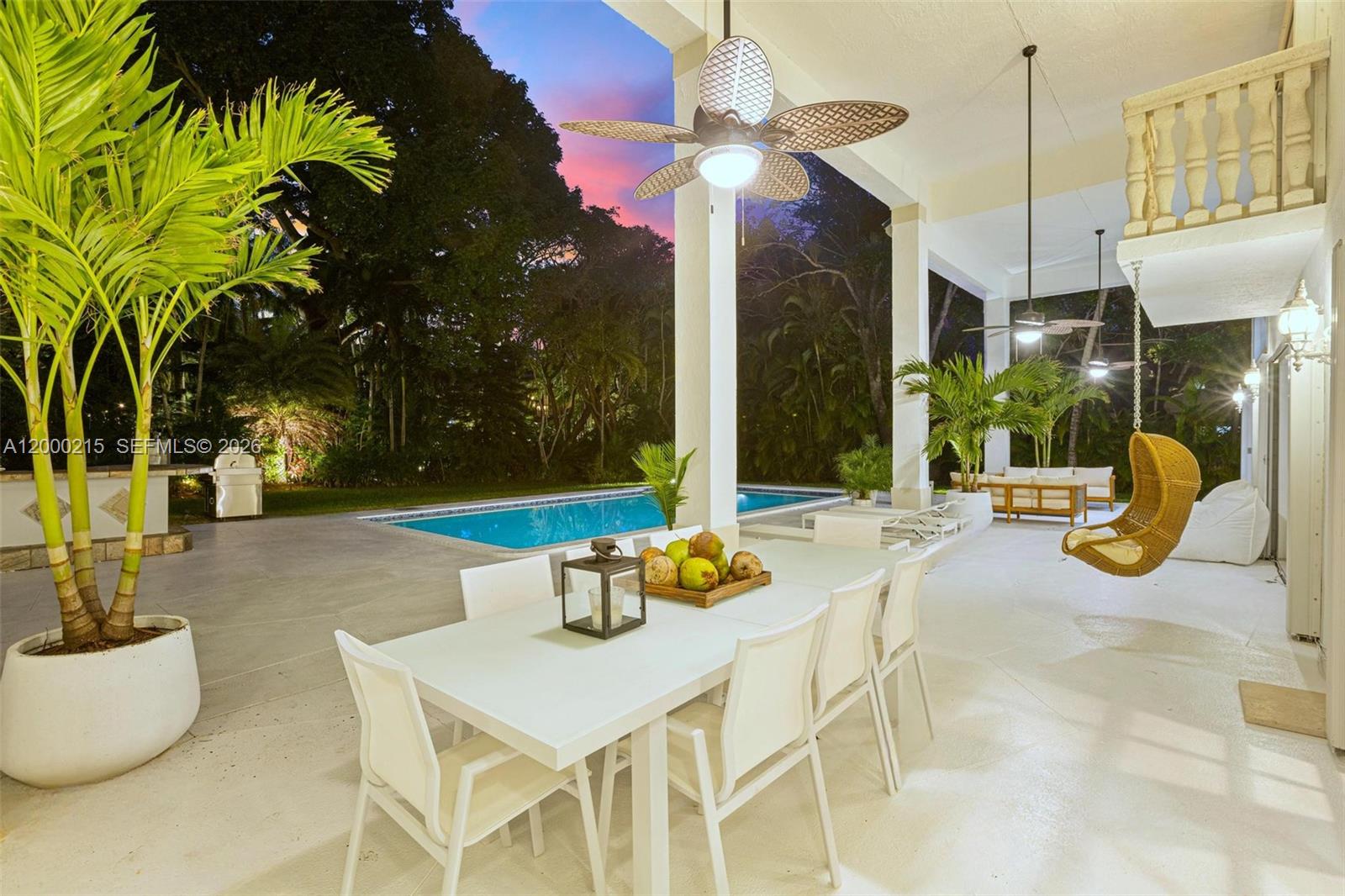 14850 Old Cutler Road Palmetto Bay, FL 33158 - Photo 19 of 19 a view of a patio with swimming pool table and chairs