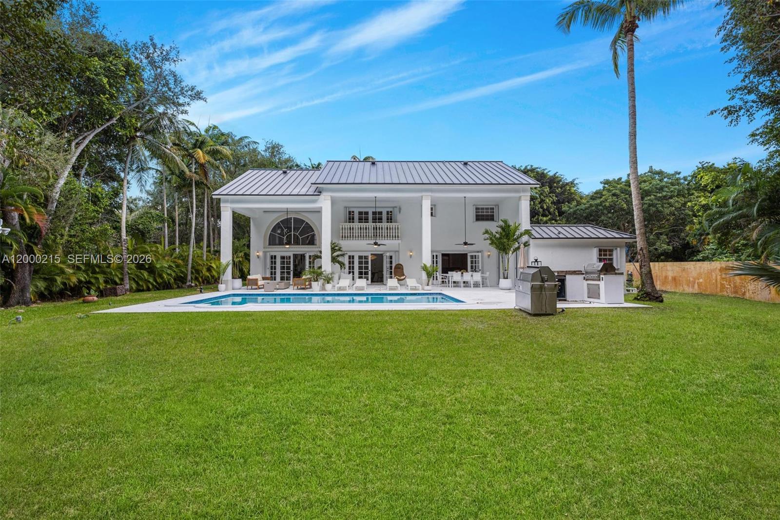 14850 Old Cutler Road Palmetto Bay, FL 33158 - Photo 2 of 19 a front view of house with yard and outdoor seating