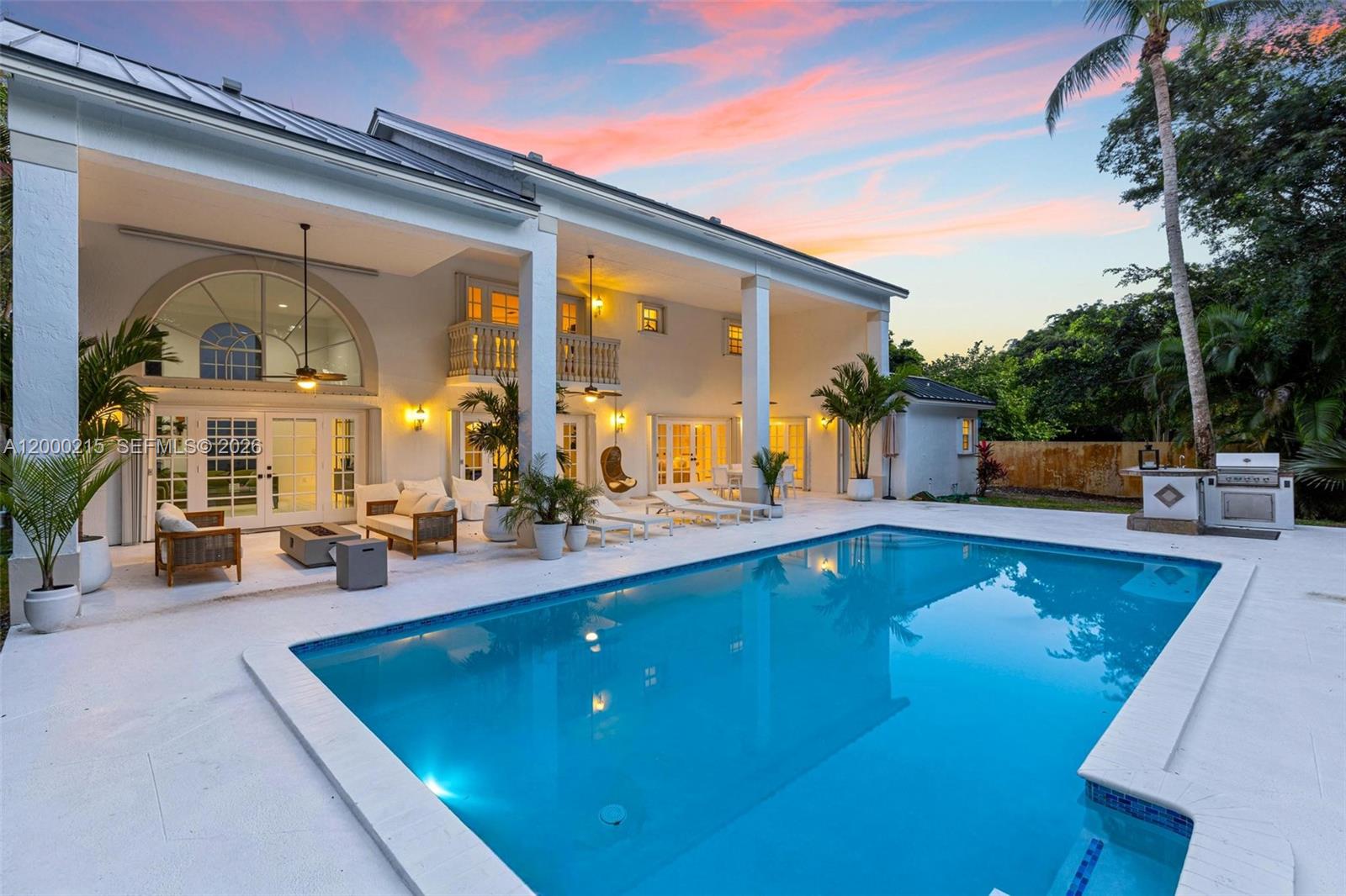 14850 Old Cutler Road Palmetto Bay, FL 33158 - Photo 8 of 19 a view of a swimming pool with a patio