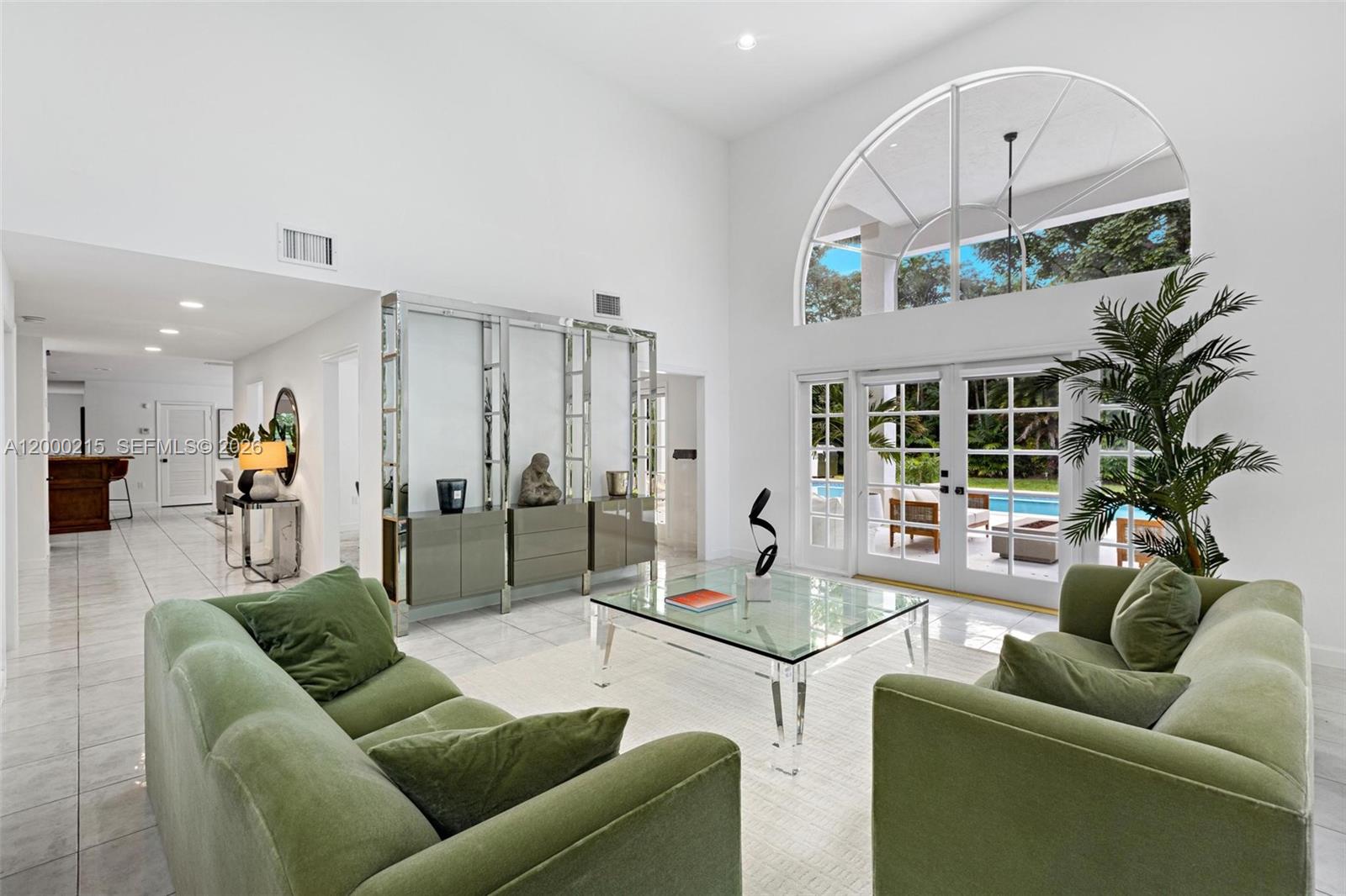 14850 Old Cutler Road Palmetto Bay, FL 33158 - Photo 10 of 19 a living room with furniture and a large window