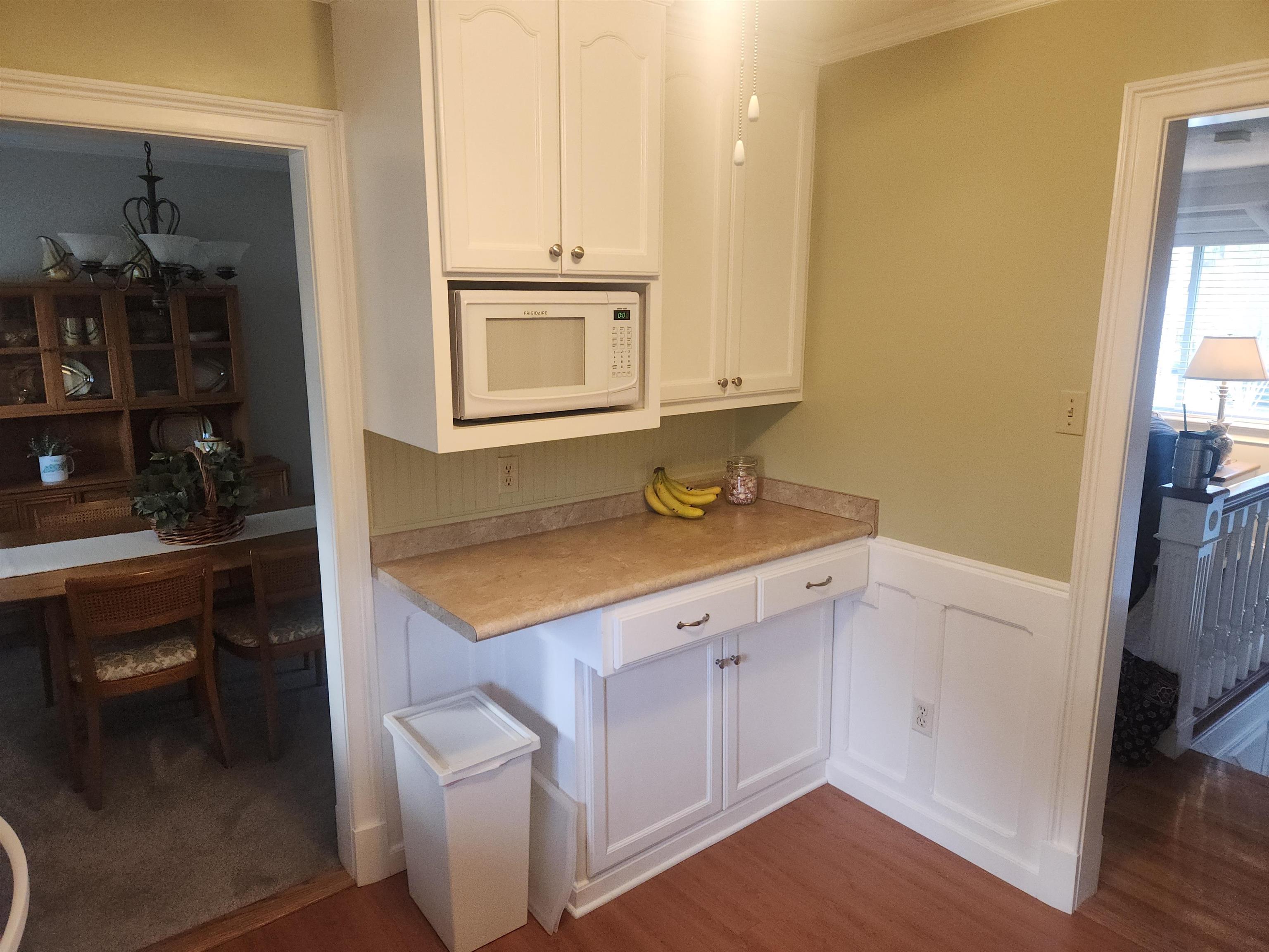 1424 Mullins Station Road Memphis, TN 38134 - Photo 11 of 40 a kitchen with a sink stove and cabinets