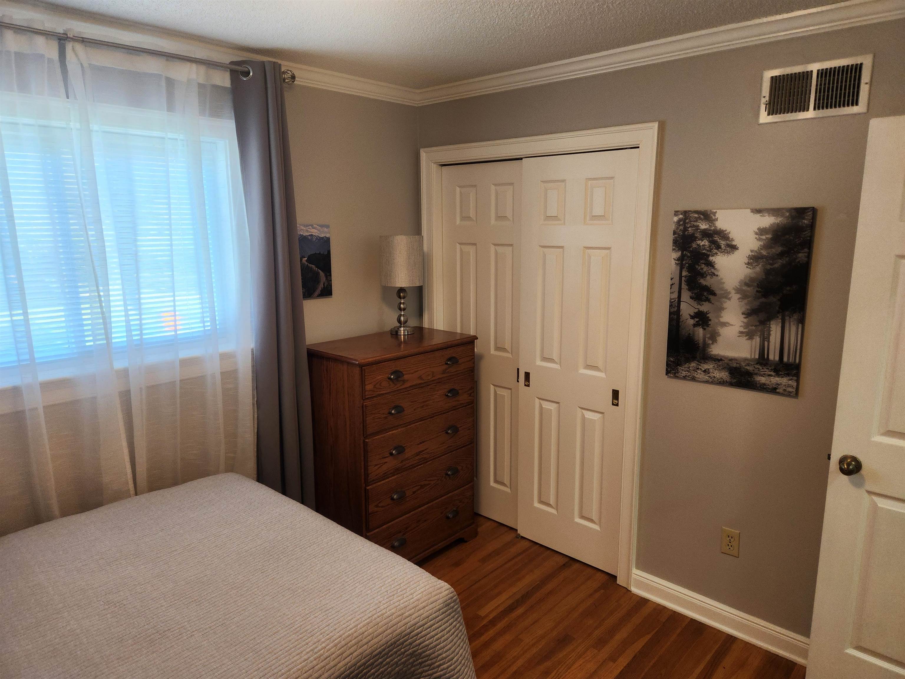 1424 Mullins Station Road Memphis, TN 38134 - Photo 19 of 40 a bedroom with a bed and a window