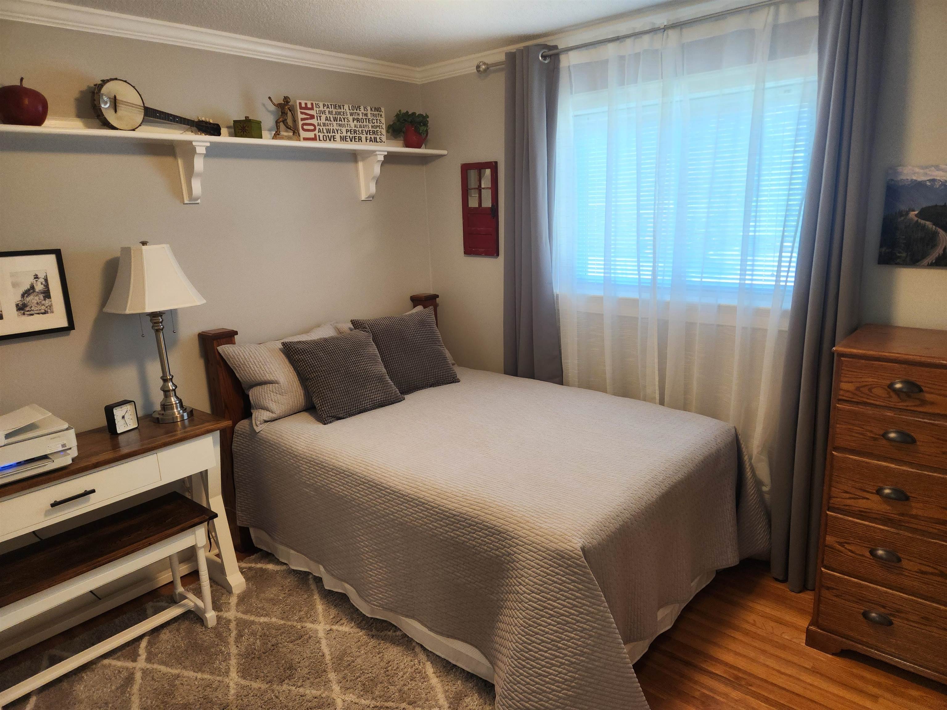 1424 Mullins Station Road Memphis, TN 38134 - Photo 20 of 40 a bedroom with a bed and a window