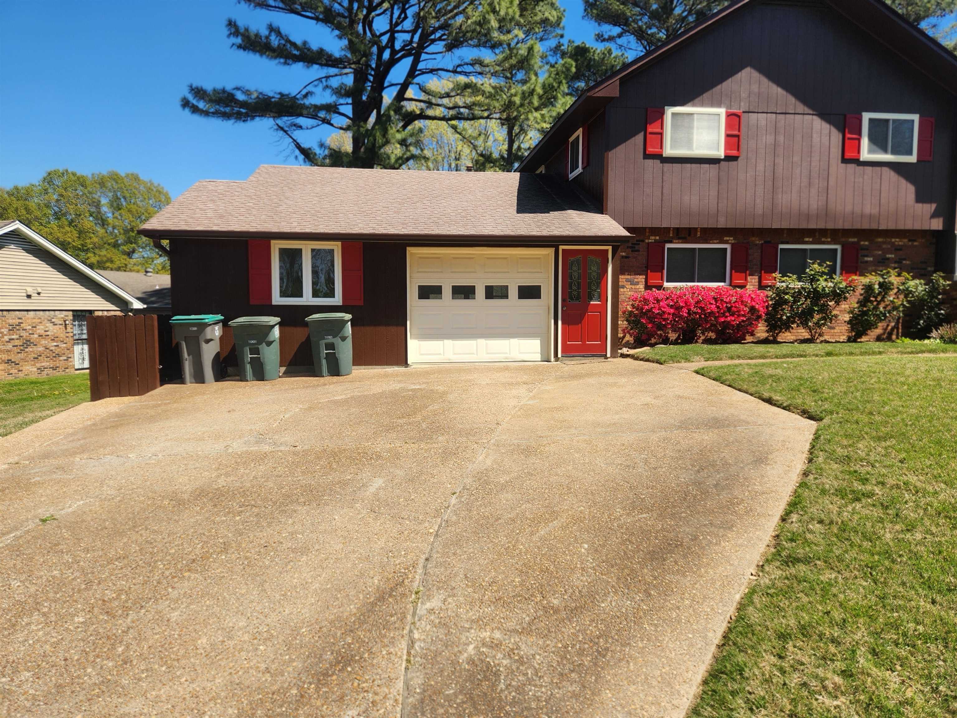 1424 Mullins Station Road Memphis, TN 38134 - Photo 2 of 40 a front view of a house with yard