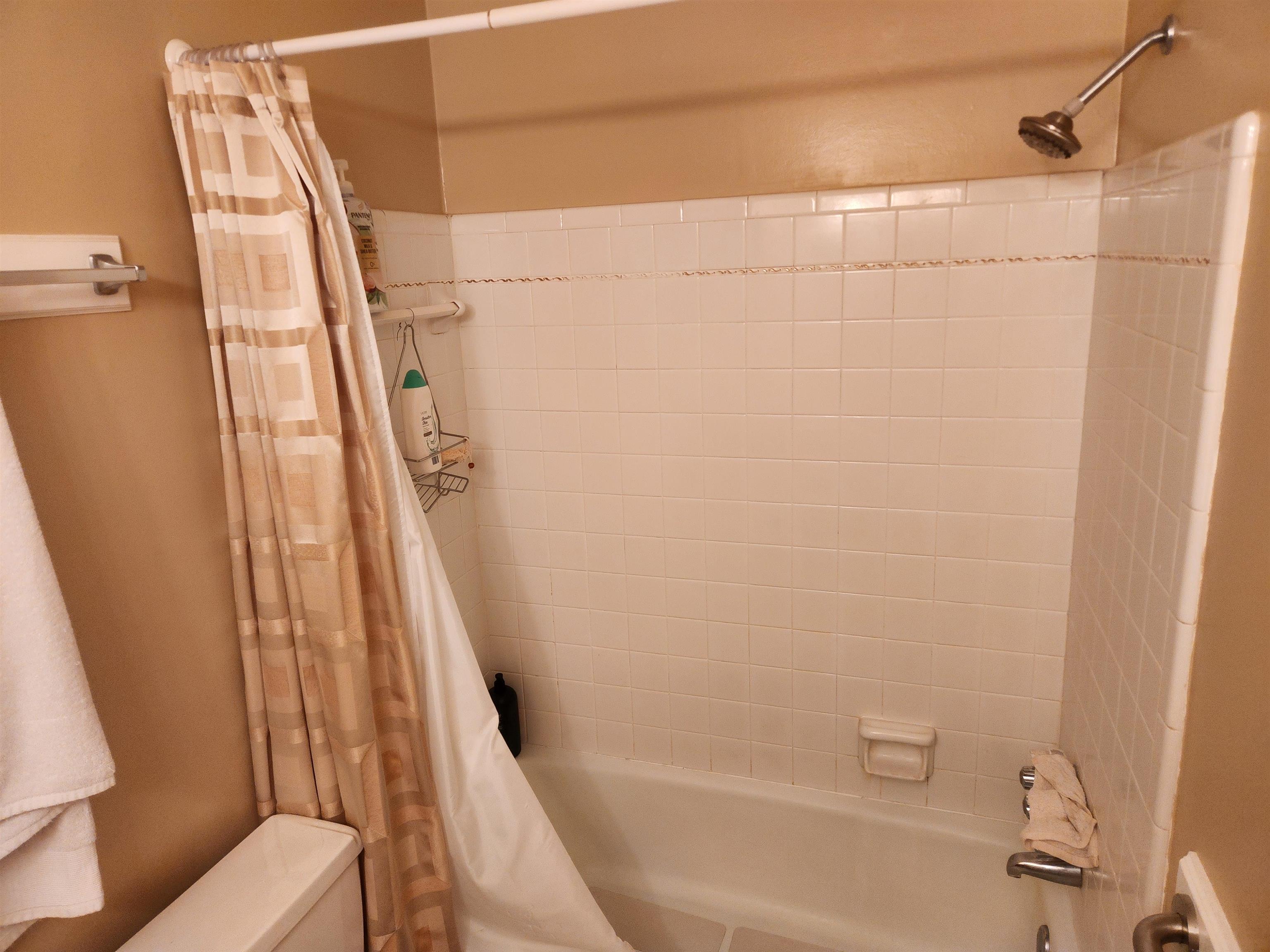 1424 Mullins Station Road Memphis, TN 38134 - Photo 22 of 40 a bathroom with a shower and a toilet