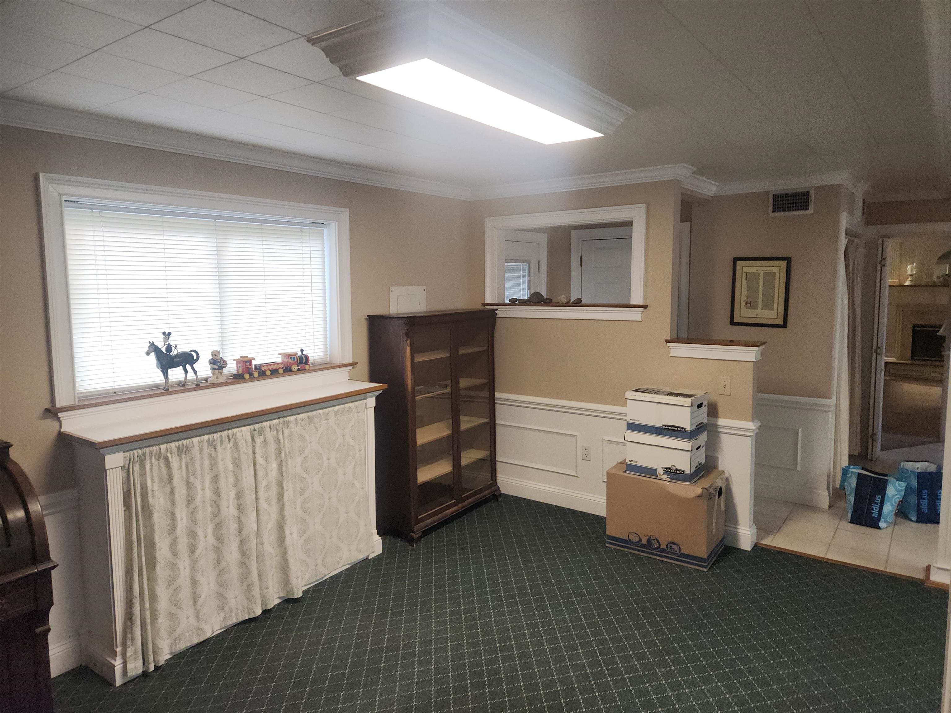 1424 Mullins Station Road Memphis, TN 38134 - Photo 30 of 40 a room with furniture a flat screen tv and white walls