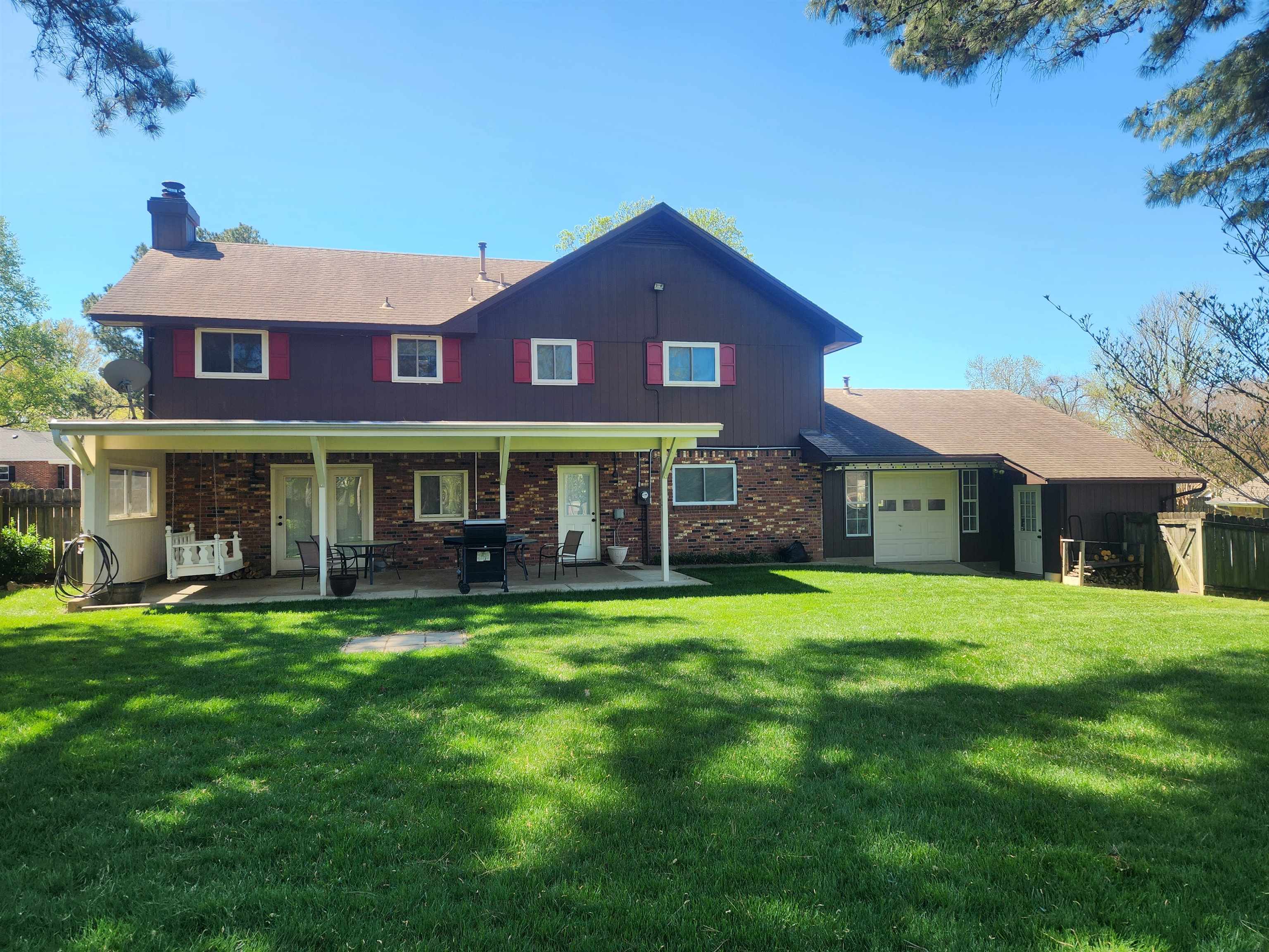 1424 Mullins Station Road Memphis, TN 38134 - Photo 37 of 40 a view of a brick house with a yard