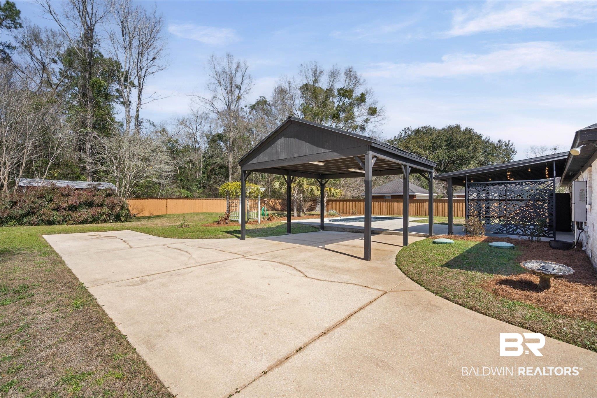 3216 Bay Booster Club Road Theodore, AL 36582 - Photo 28 of 46 Fenced backyard featuring a patio and concrete driveway