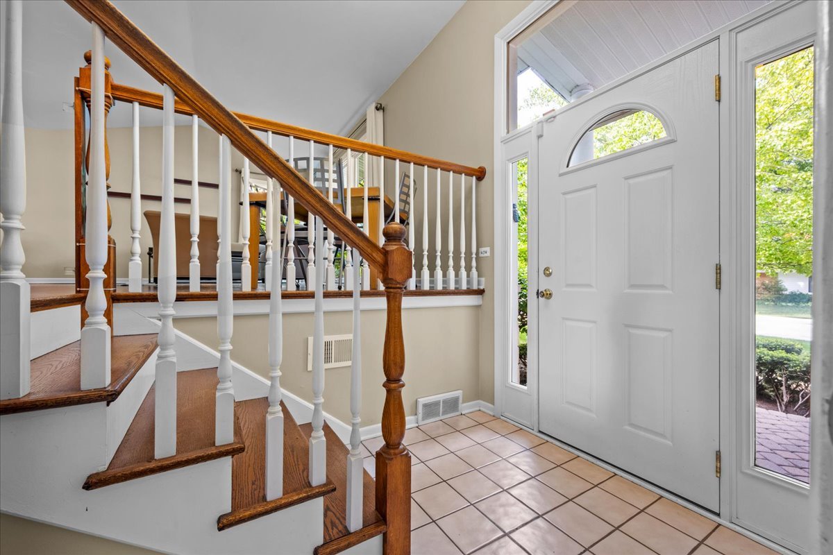 1115 Kenton Road Deerfield, IL 60015 - Photo 3 of 30 a view of an entryway with wooden floor and door