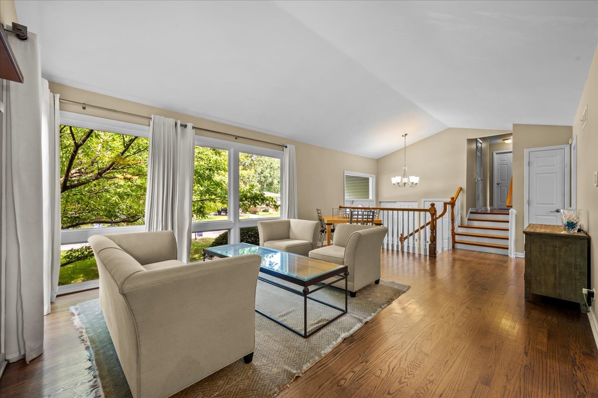 1115 Kenton Road Deerfield, IL 60015 - Photo 6 of 30 a living room with furniture and floor to ceiling windows