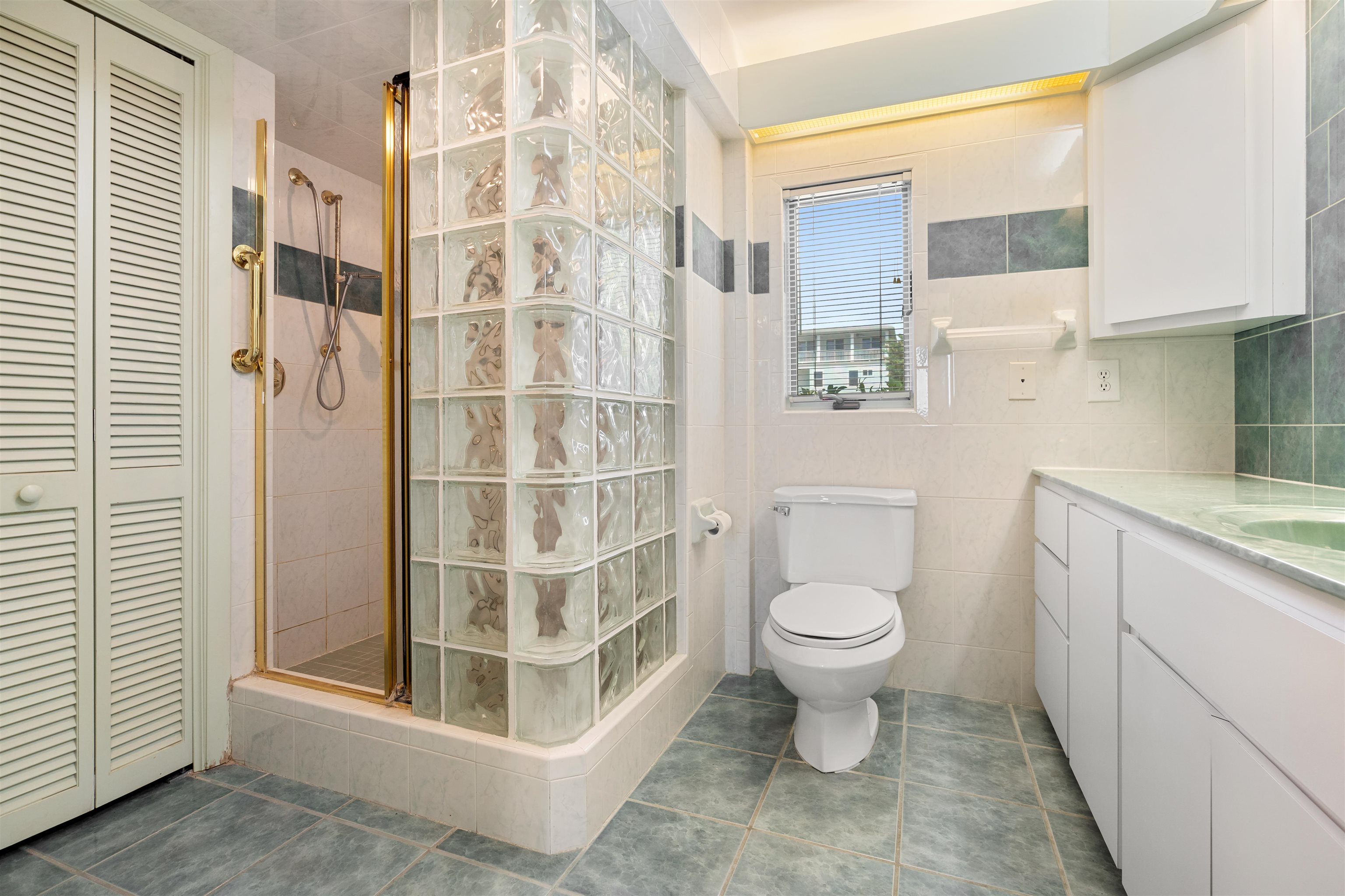 65 Busam Street St. Augustine, FL 32080 - Photo 16 of 59 a bathroom with a toilet sink and a shower