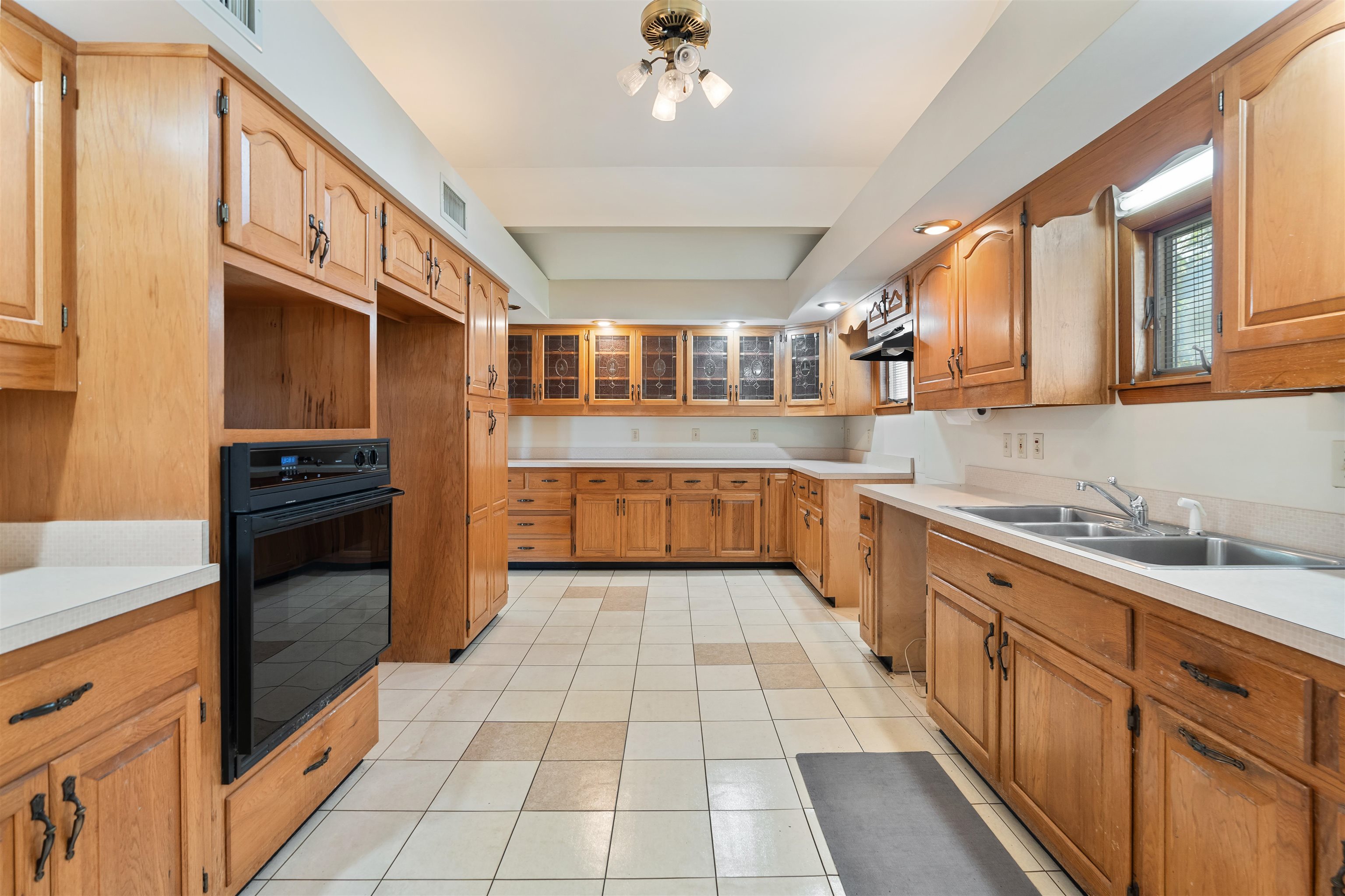 65 Busam Street St. Augustine, FL 32080 - Photo 21 of 59 a kitchen with stainless steel appliances granite countertop a sink and cabinets