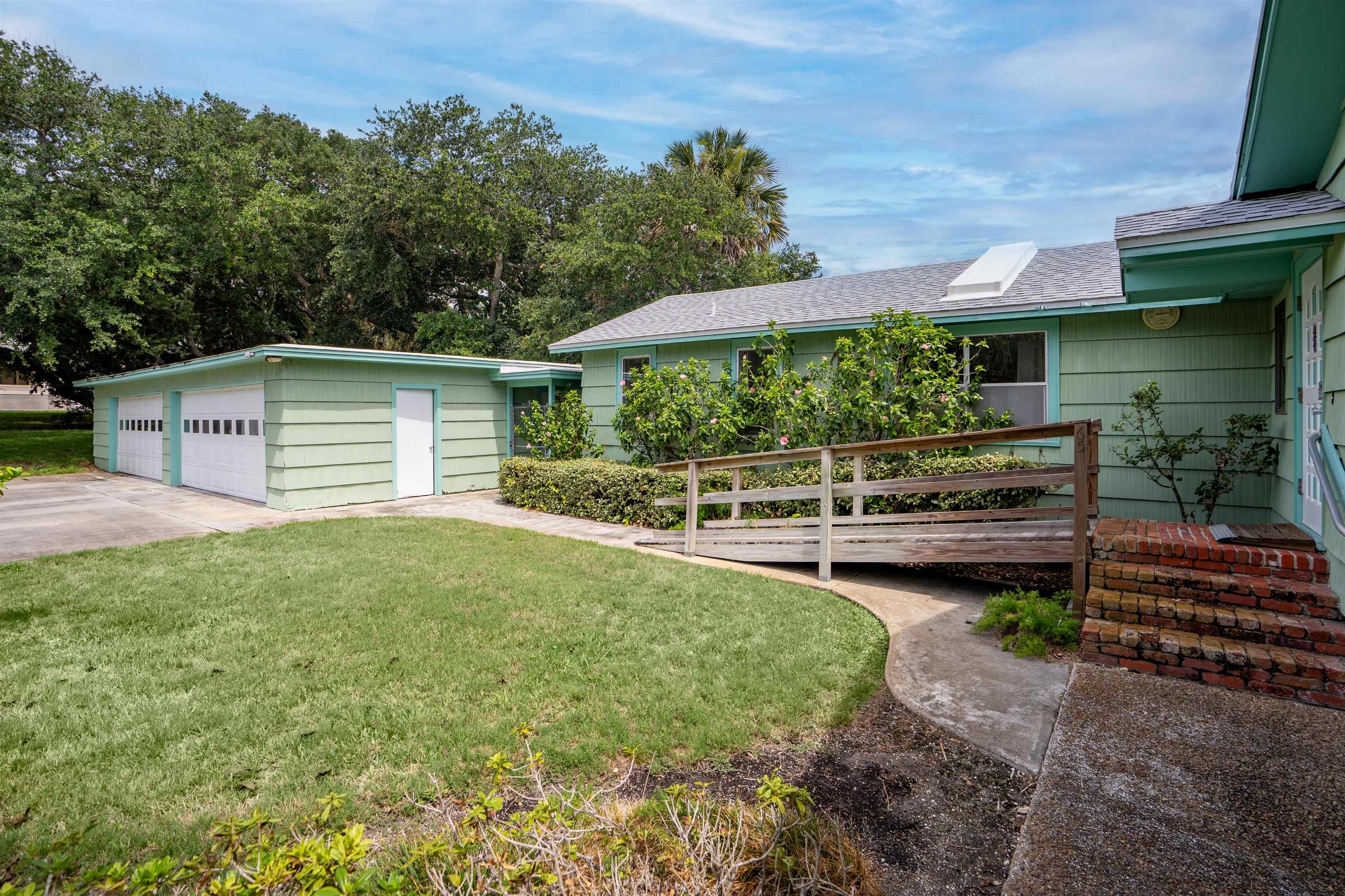 65 Busam Street St. Augustine, FL 32080 - Photo 36 of 59 a view of a house with backyard and sitting area