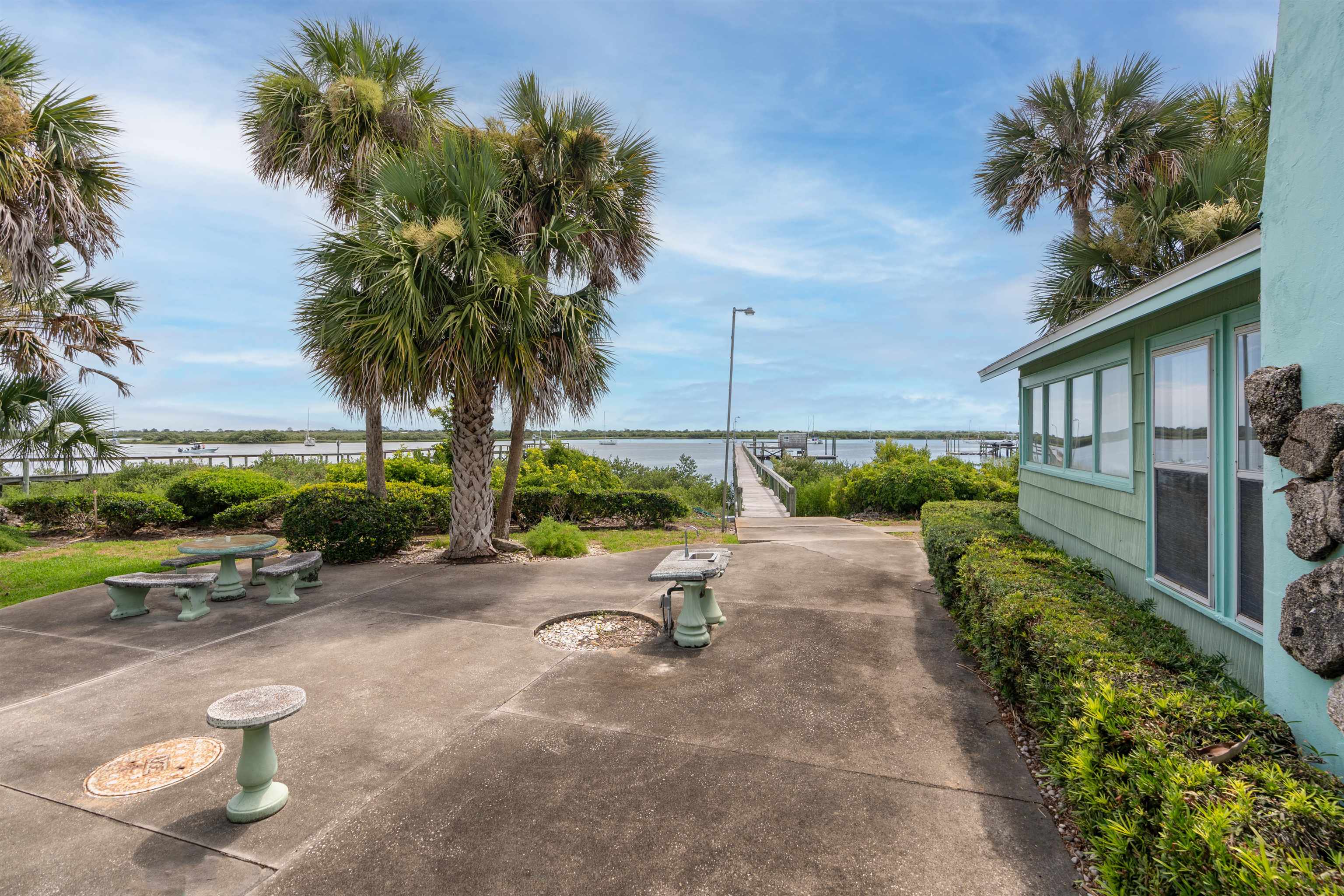 65 Busam Street St. Augustine, FL 32080 - Photo 39 of 59 a park with potted plants and a palm tree