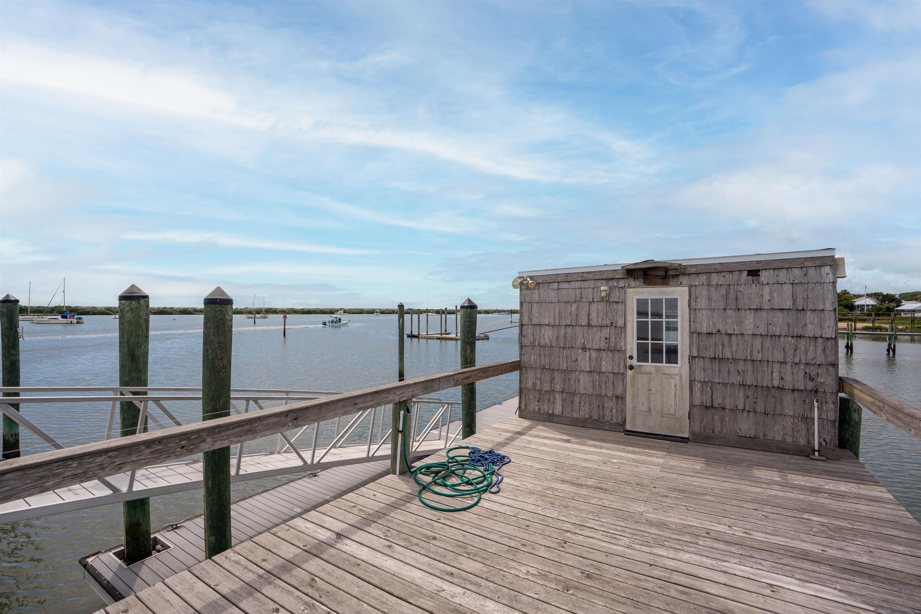 65 Busam Street St. Augustine, FL 32080 - Photo 46 of 59 a view of roof deck with wooden floor and fence