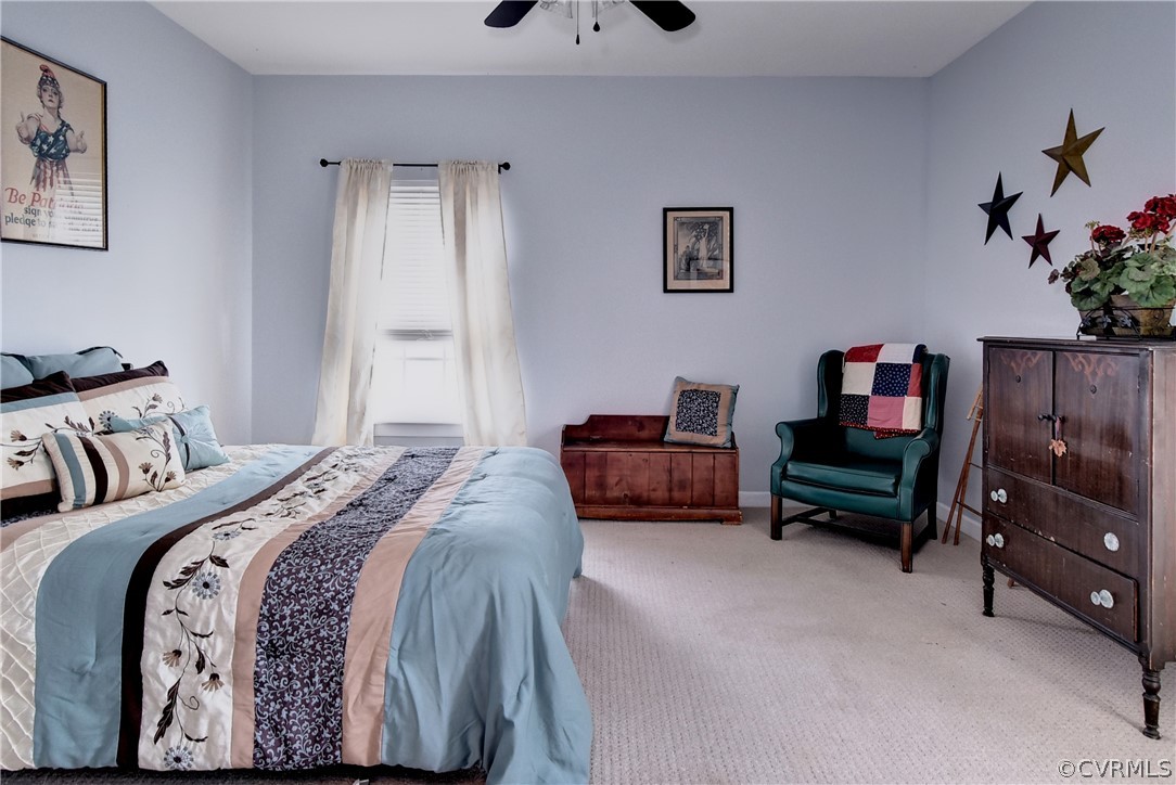 3986 Bournemouth Bend Williamsburg, VA 23188 - Photo 12 of 47 a bedroom with a bed and a couch