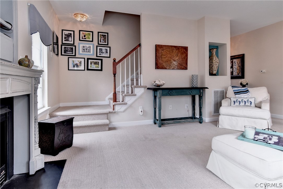 3986 Bournemouth Bend Williamsburg, VA 23188 - Photo 16 of 47 a living room with furniture and a fireplace